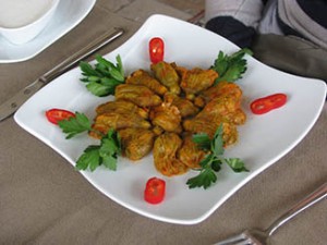A plate with stuffed squash blossoms.