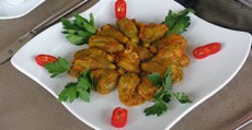 A plate with stuffed squash blossoms.